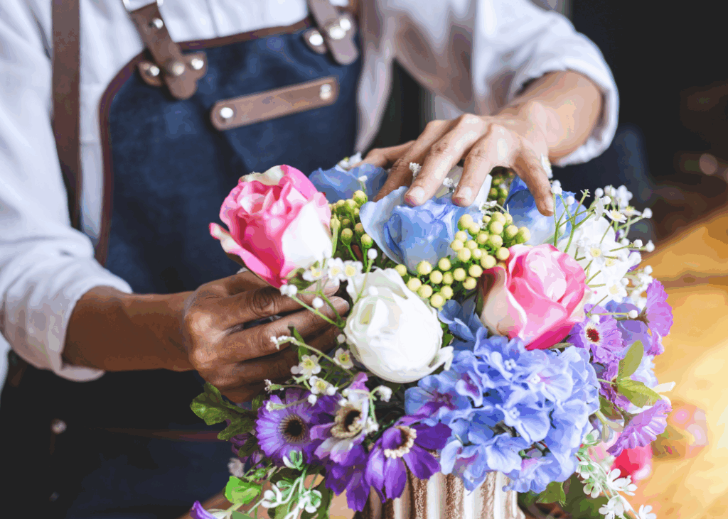 A closeup Image of a Flower being Fixed by some flower seller